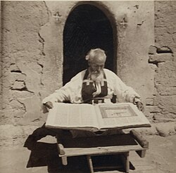 Assyrian priest with manuscript, Khabur river valley area, 1939