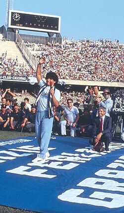 Maradona saluting the crowd at the Stadio San Paolo in Naples during his presentation on 5 July 1984