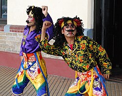 Dancers performing physical comedy
