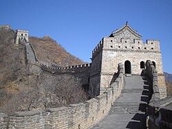 The Great Wall of China: while segments of earlier rammed earth walls were first unified by the Qin and Han dynasties, the vast majority of the brick and stone Great Wall is a product of the Ming.
