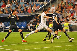 Kaká takes on Tottenham Hotspur defender Michael Dawson in the UEFA Champions League, April 2011