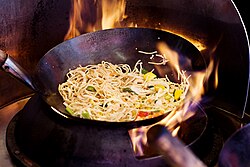 Stir-frying noodles using wok