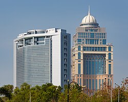 The State Administrative Building (right), behind the Wisma Innoprise (left)