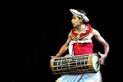A Low Country drummer playing the traditional Yak Béra