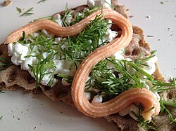 Smörgåskaviar as a condiment on a crispbread with cottage cheese and dill.