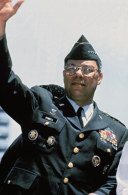 Powell, as chairman of the Joint Chiefs of Staff, waves from his motorcade during the Persian Gulf War Welcome Home Parade in New York City.