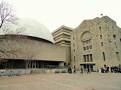 The McLaughlin Planetarium next to the museum. The planetarium was operated by the museum from 1968 to 2009; the structure was demolished in 2026.