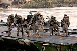 20th Engineer Brigade soldiers construct a bridge on the Euphrates River.
