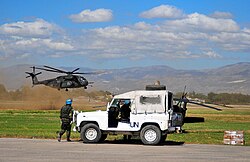 MINUSTAH troops meet a U.S. relief flight on 16 January.