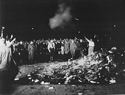 A Nazi book burning on 10 May 1933 in Berlin, as books by Jewish and leftist authors are burnt[430]