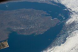 Lake Michigan–Huron with north oriented to the right; taken on April 14, 2022, during Expedition 67 of the International Space Station. Green Bay is at the upper right and Saginaw Bay is on the left.