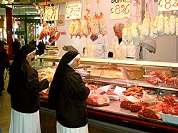 Catholic nuns buying meat in Italy