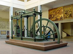 A Watt steam engine. The steam engine, made of iron and fueled primarily by coal, propelled the Industrial Revolution in Great Britain and the world.[95]