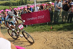Adrien Niyonshuti, "one of the most famous people in Rwanda",[401] competing in the cross-country mountain biking event at the 2012 Summer Olympics