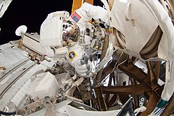 NASA Astronaut Reid Wiseman inspects the steel framework of the truss structure
