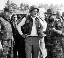 Marine Gen. P.X. Kelley (left) and Col. Tim Geraghty (right) take Vice President George H. W. Bush on a tour of the Beirut barracks bombing, two days after the explosion.