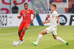 Olmo (right) and Bayern Munich's Serge Gnabry in the 2022 DFL-Supercup