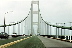 The Mackinac Bridge, which carries I-75, has no hard shoulders, and has only a 4-inch-high (10 cm) divider between the opposing directions.