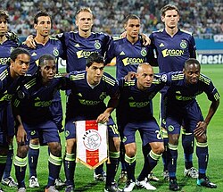 Suárez (with the Ajax pennant) as Ajax captain in 2010. Suárez was named captain in the 2009–10 season.