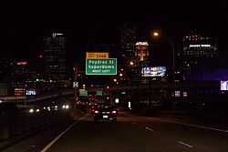 The interstate 10 exit that leads directly into the "Downtown" New Orleans area at night.