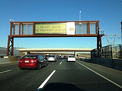 A modern variable message sign near Exit 7A displaying a warning about congestion