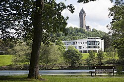 Airthrey Loch, the university's Cottrell Building and the Wallace Monument.