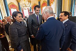 Tamin and his wife Sheikha Jawaher at a reception for the coronation of Charles III in 2023
