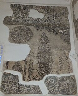 Partially preserved mural decoration inside the Murad II Mosque in Edirne, circa 1436, depicting stylized trees and plants alongside calligraphic inscriptions
