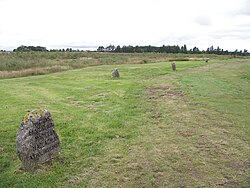 In 1881, Duncan Forbes erected the headstones that mark the mass graves of fallen Jacobite soldiers. They lie on either side of an early 19th-century road which runs through the battlefield.[51]