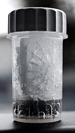 Contact lenses soaking in a 3% hydrogen peroxide-based solution. The case includes a catalytic disc which neutralises the hydrogen peroxide over time.