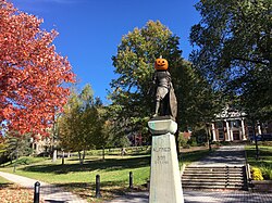 The statue of King Alfred the Great stands at the center of AU's quad, and is often decorated by students. In this picture, he has a Jack-o'-lantern on his head for Halloween 2019, leading to his temporary renaming as 'Pumpking Alfred'.