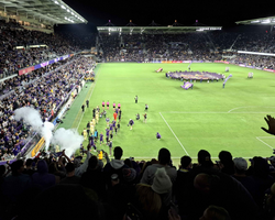 Orlando City and New York Red Bulls players emerge onto the field at the start of the 2024 Eastern Conference final