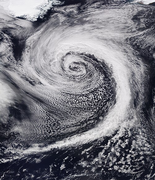 A powerful extratropical cyclone over the North Atlantic Ocean on 20 March 2022; Greenland at the top left, and Iceland at the top right