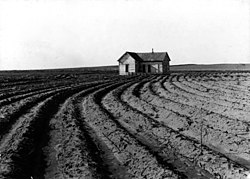 Power farming displaces tenants from the land in the western dry cotton area. Childress County, Texas, 1938.