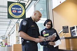 Canadian and American border security officers working together