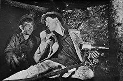 Aleksei Stakhanov with a fellow miner. Stalin's government initiated the Stakhanovite movement in order to encourage hard work.[243]