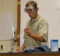 The presence of copper in this qualitative analysis is indicated by the bluish-green color of the flame.