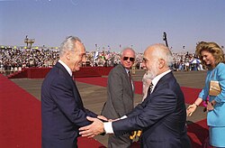 Shimon Peres (left) with Yitzhak Rabin (center) and King Hussein of Jordan (right), prior to signing the Israel–Jordan peace treaty in 1994