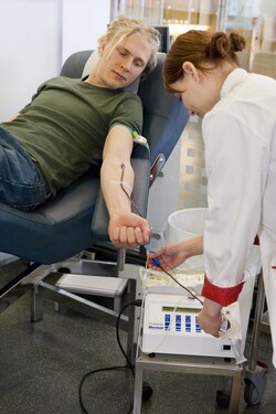 A man donating blood at Finnish Red Cross Blood Service [fi]