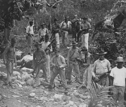 U.S. Marines and guide in search of Haitian Cacos fighters against the U.S. occupation of Haiti, c. 1919