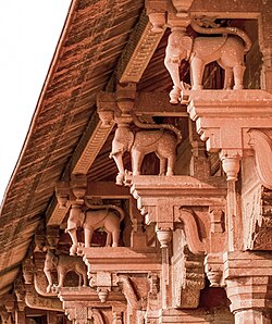 The use of elephant-shaped column brackets in buildings of the Lahore Fort reflects Hindu influences on Mughal Architecture during the reign of Akbar even though Islam generally forbids representation of living figures.