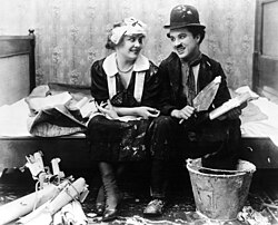 Chaplin and Edna Purviance, his regular leading lady, in Work (1915)