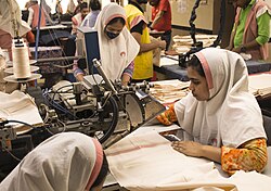 Women work in a textile factory outside Dhaka, Bangladesh.