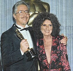 Director Luis Puenzo and actress Norma Aleandro (the latter being one of the co-presenters of the award alongside Jack Valenti) celebrating the Oscar won as "Best Foreign Film" at the 58th Academy Awards