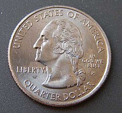 Coin with partially rubbed off "In God We Trust" motto