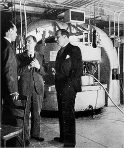 Enrico Fermi, John R. Dunning, and Dana P. Mitchell in front of the cyclotron in the basement of Pupin Hall at Columbia University, 1940