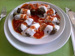 Stuffed vine leaves served with yogurt