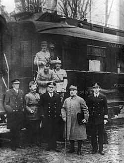 Ferdinand Foch (second from right) pictured outside the carriage in Compiègne after agreeing to the armistice that ended the war there.[206]