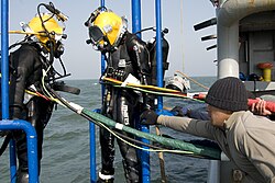 A South Korean and U.S. diver during the recovery phase