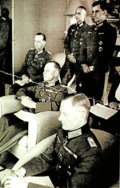 A meeting of the military resistance's inner circle and Rommel at Mareil-Marly 15 May 1944. From left, Speidel (behind), Rommel (centre), Stülpnagel (front). Rudolf Hartmann stands at left.